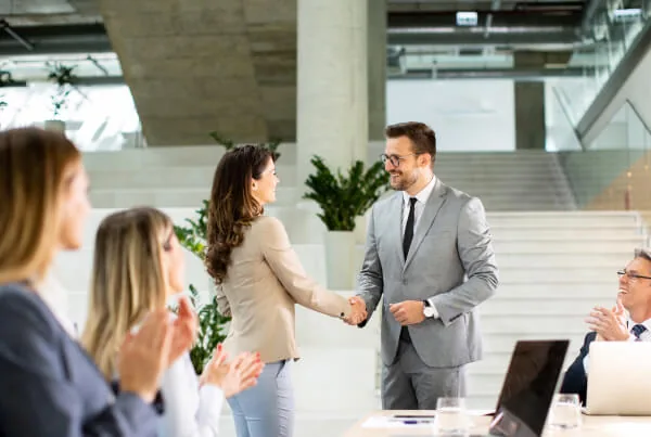 Professionals greeting each other during a business meeting