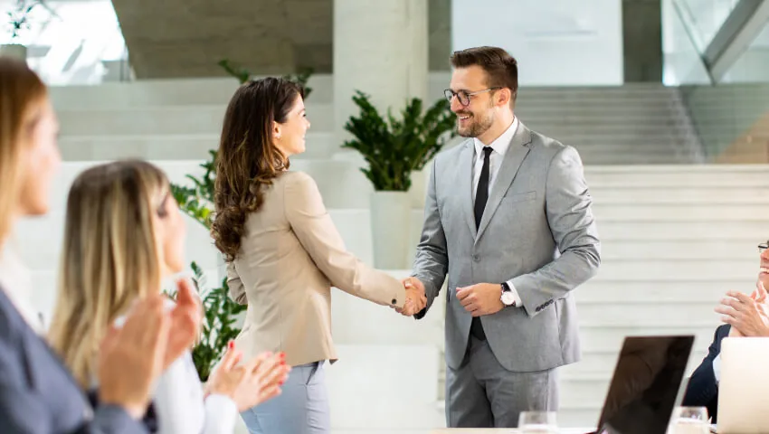 Professionals shaking hands after a business discussion